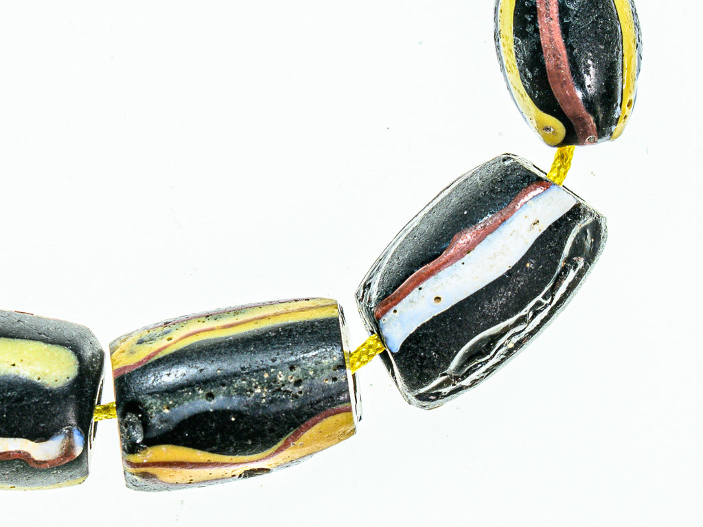 Antique Venetian African Trade Black Beads With Yellow, Green Red and White Stripes, group of 14