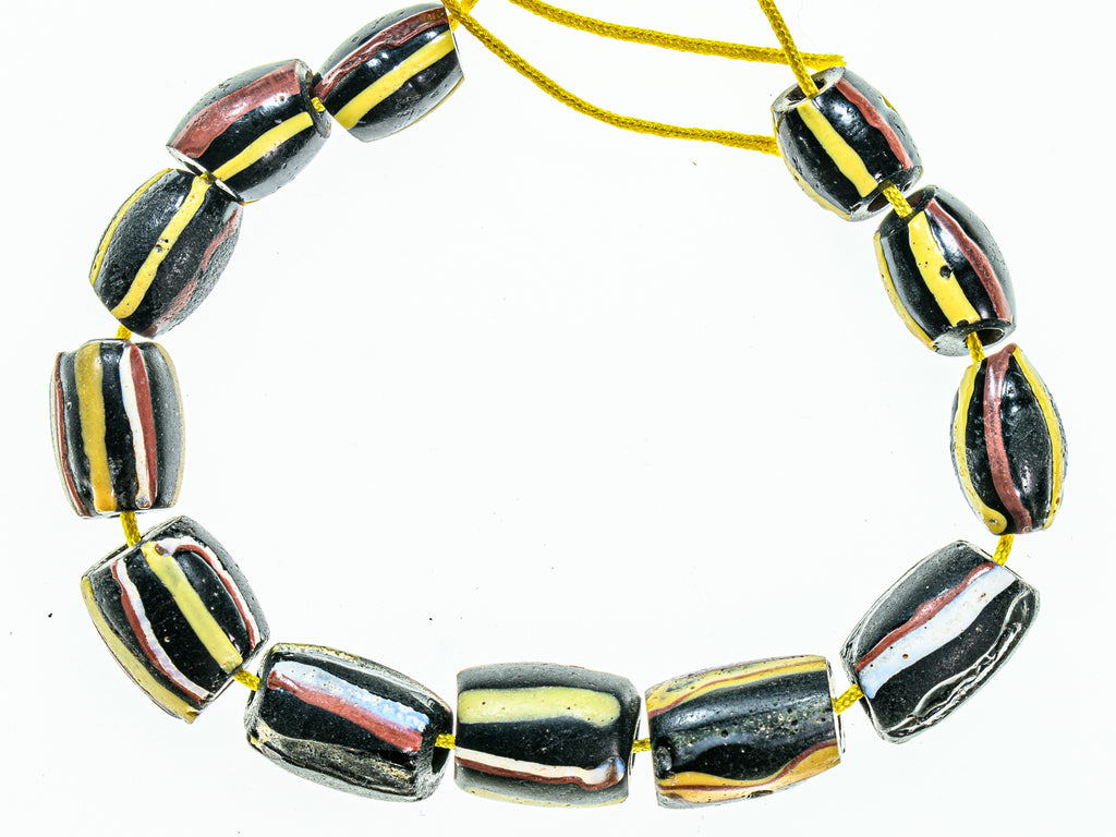 Antique Venetian African Trade Black Beads With Yellow, Green Red and White Stripes, group of 14