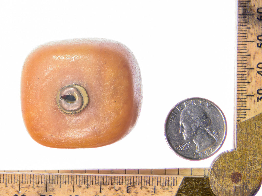 A Very Large Antique Natural Pressed  Baltic Amber Capped Bead From the African Trade