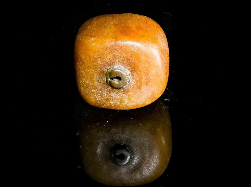 A Very Large Antique Natural Pressed  Baltic Amber Capped Bead From the African Trade