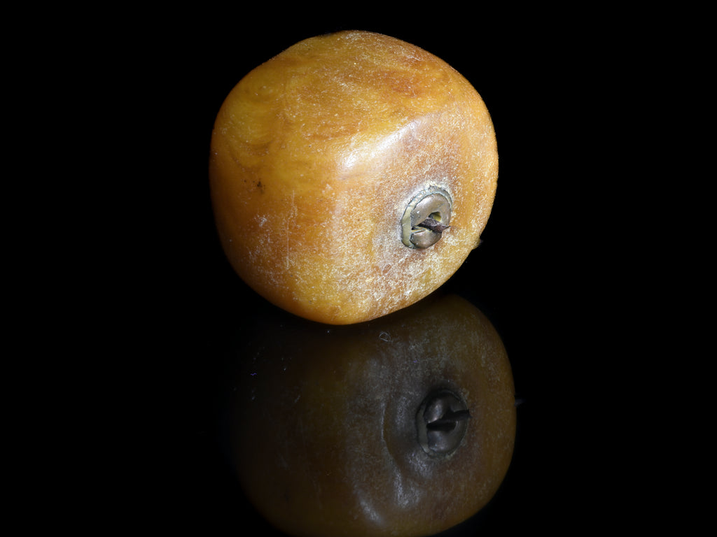 A Very Large Antique Natural Pressed  Baltic Amber Capped Bead From the African Trade