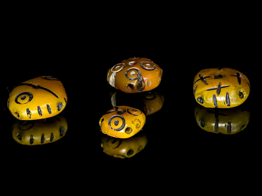 A Group of 4 Yellow-Orange Faux Amber Carved Diamond-Shaped Resin Beads from Morocco