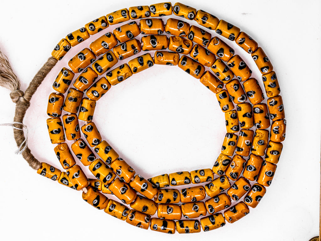 A Very Long Strand of Rare Antique Yellow with Black and White Eyes Millefiori African Trade Beads