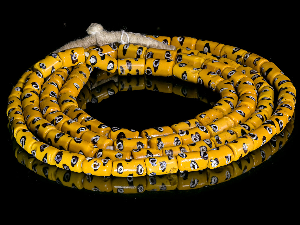 A Very Long Strand of Rare Antique Yellow with Black and White Eyes Millefiori African Trade Beads