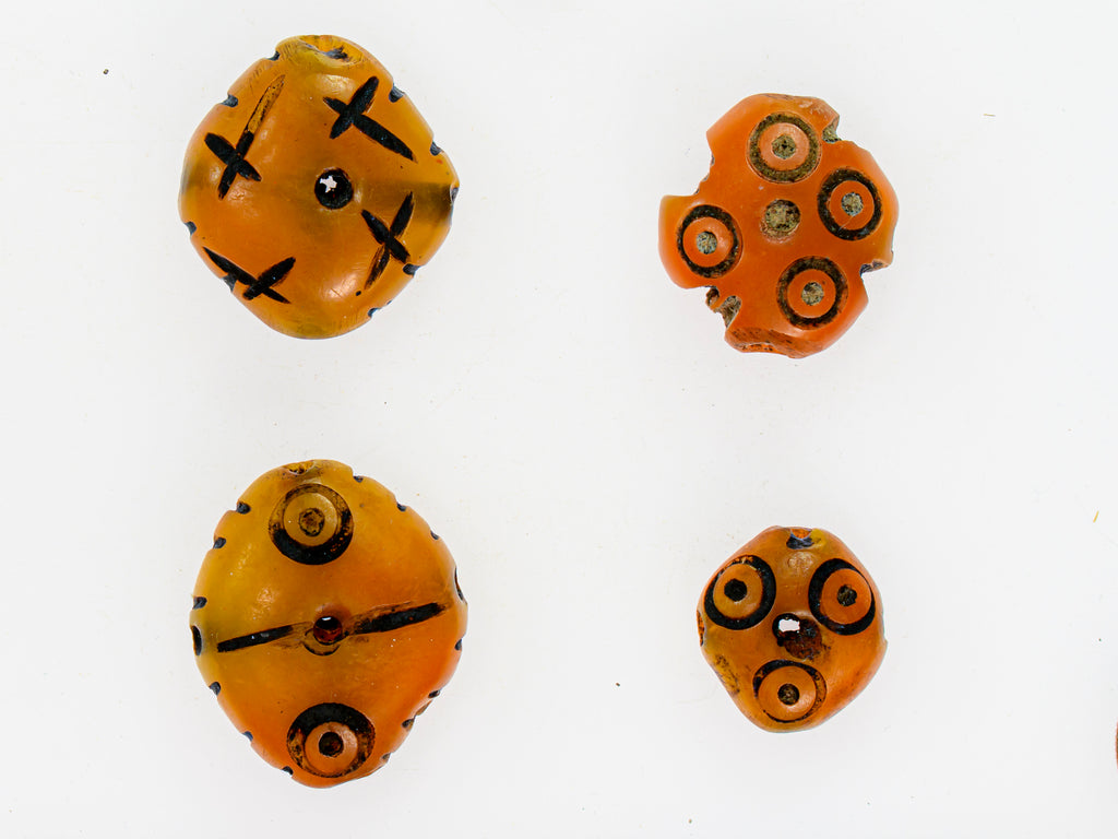 A Group of 4 Yellow-Orange Faux Amber Carved Diamond-Shaped Resin Beads from Morocco