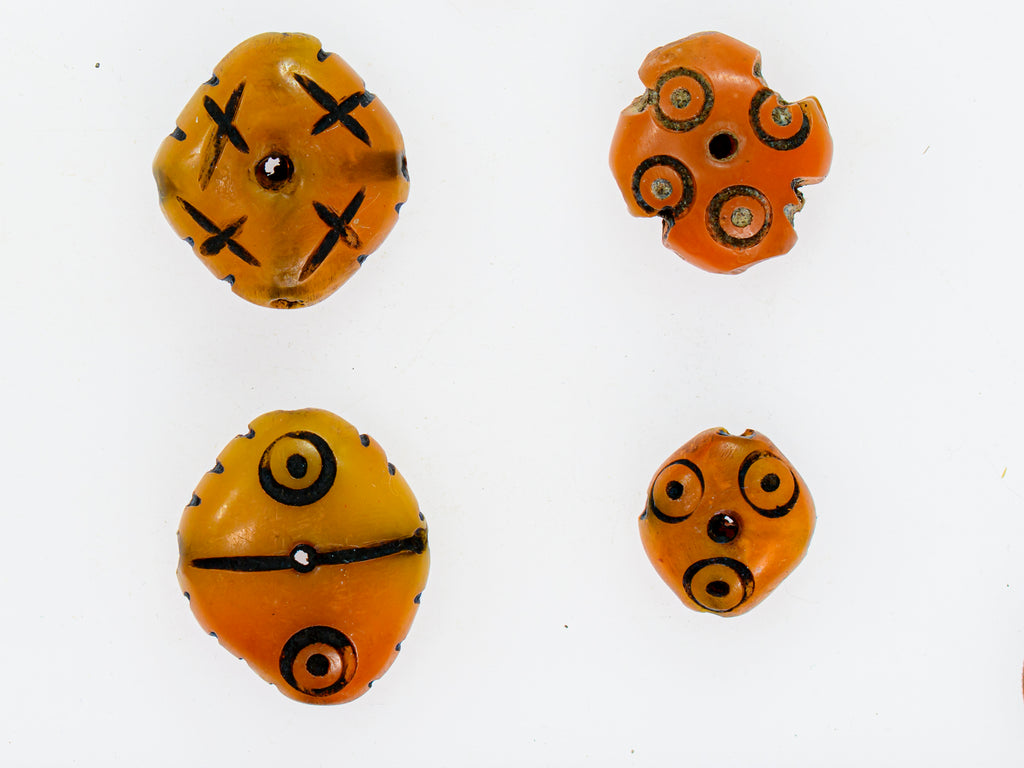 A Group of 4 Yellow-Orange Faux Amber Carved Diamond-Shaped Resin Beads from Morocco