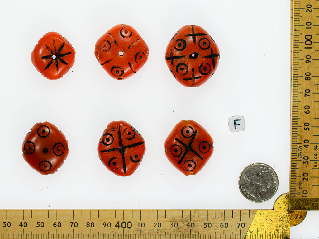 A Group of 6 Dark Orange Faux Amber Carved Diamond-Shaped Resin Beads from Morocco