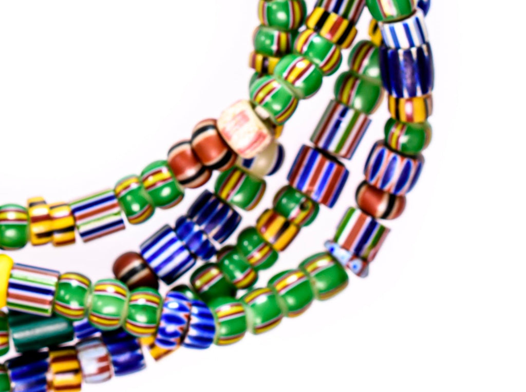 A Long Strand of Mixed Mostly Green Blue and Yellow Antique Chevrons and A Speo Venetian African Trade Beads