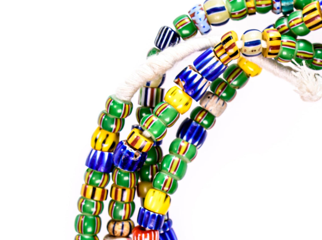 A Long Strand of Mixed Mostly Green Blue and Yellow Antique Chevrons and A Speo Venetian African Trade Beads