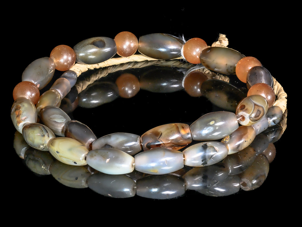 A Strand of Vintage African Trade Multi-color Agate Bicone and Round Beads