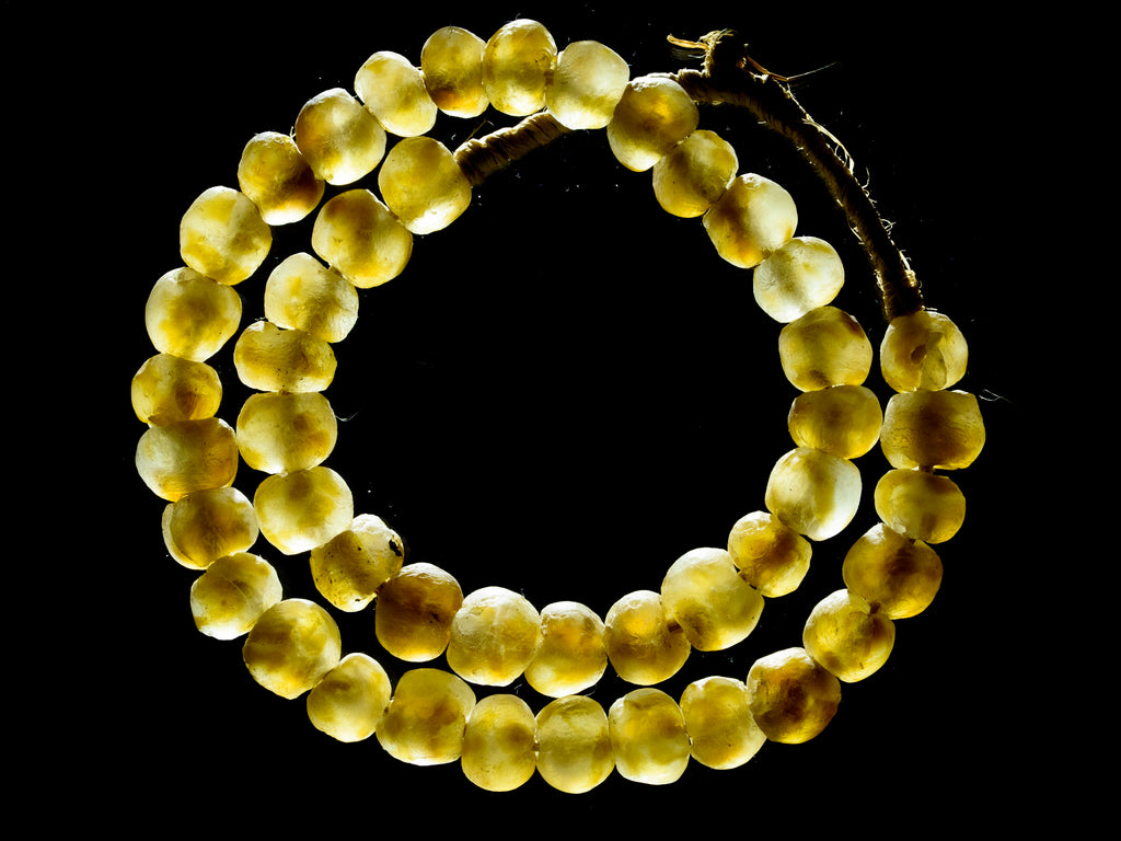 A 23" Strand of Recycled Glass Beads from Ghana, Amber Swirl 