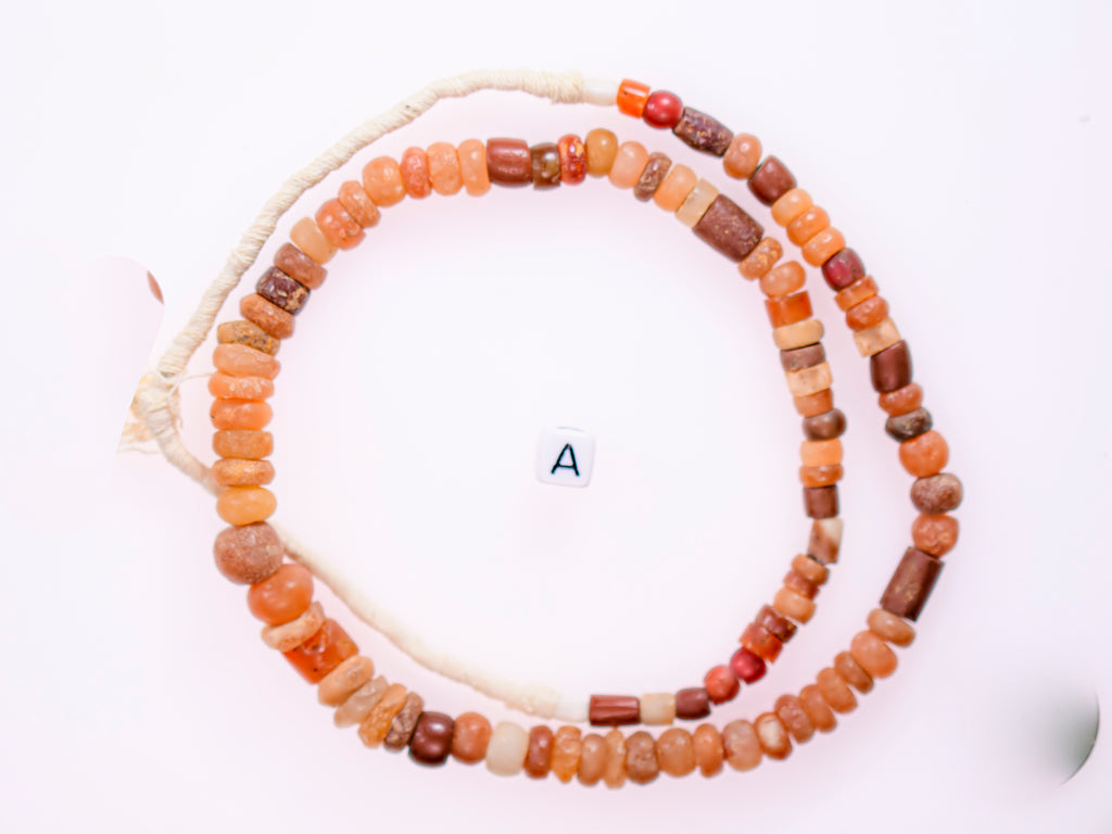 Ancient excavated mixed strand of agate, and other ancient stone