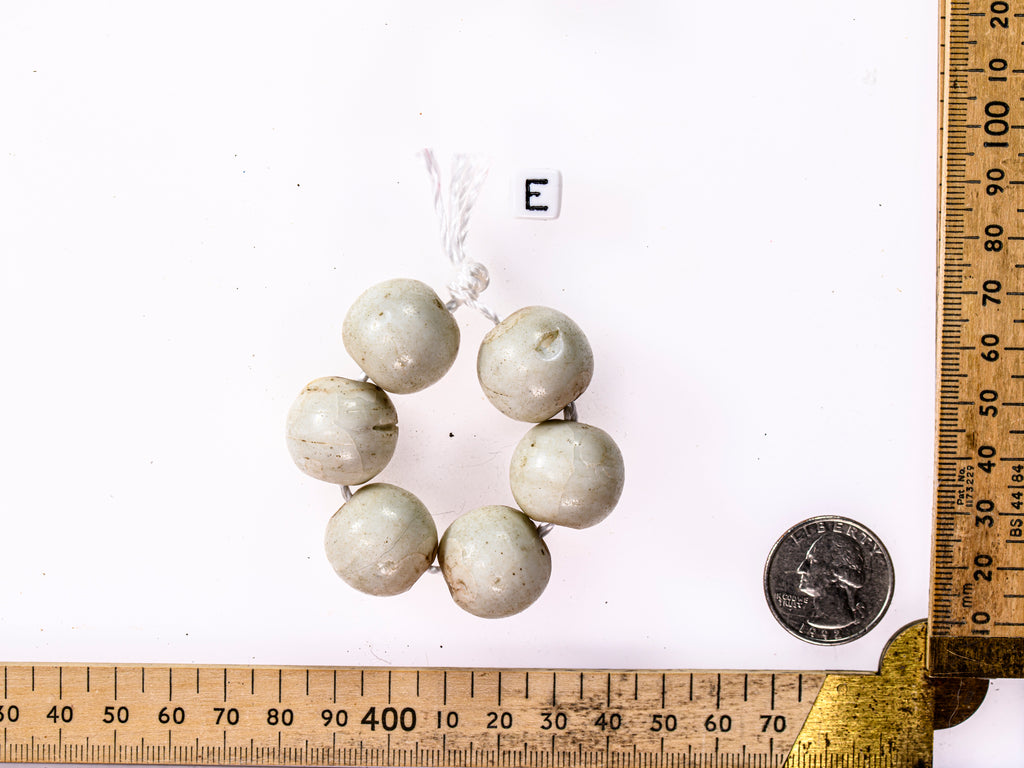 A Short Strand of 6 Antique European Matte White Beads from the African Trade