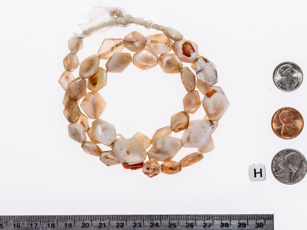 Ancient excavated rare  diamond-shaped agate strands