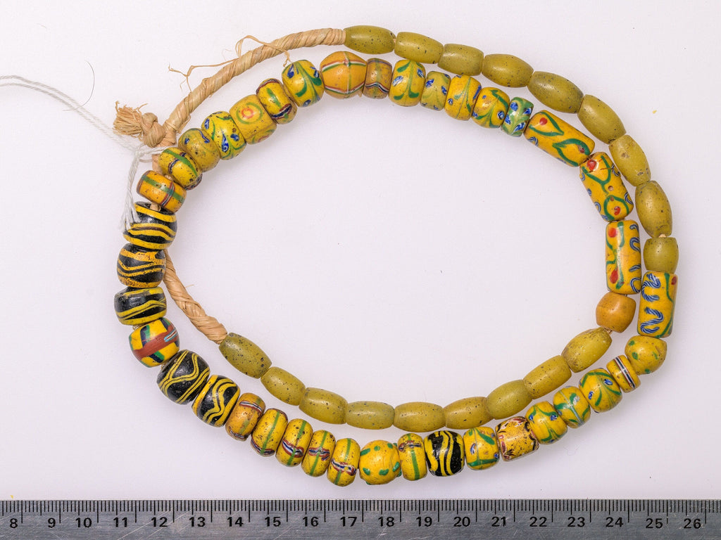 A Strand of Antique Venetian and Bohemian African Trade Beads in Yellow hues  (0262A)