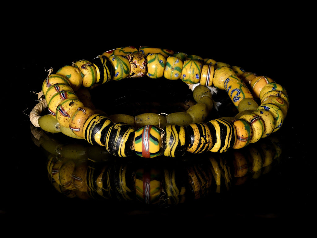 A Strand of Antique Venetian and Bohemian African Trade Beads in Yellow hues  (0262A)