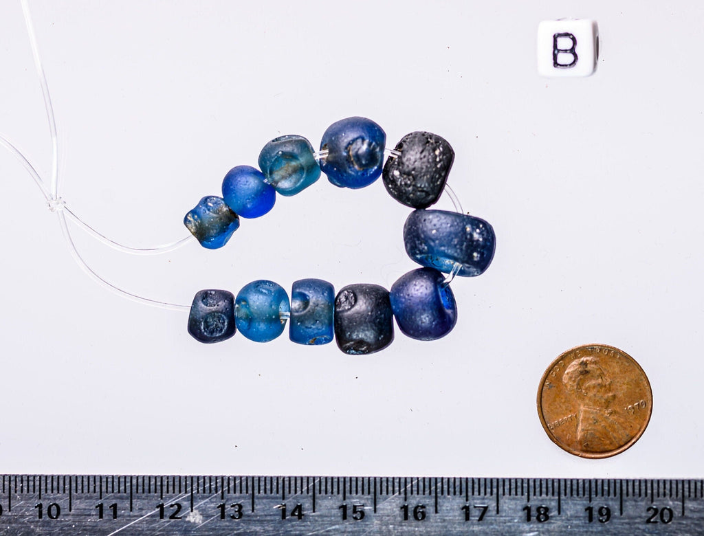 A Short Strand of Small Blue Ancient Islamic Period Beads 0747