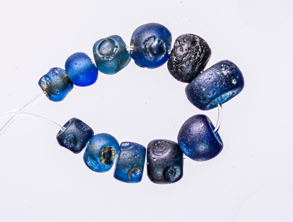 A Short Strand of Small Blue Ancient Islamic Period Beads 0747