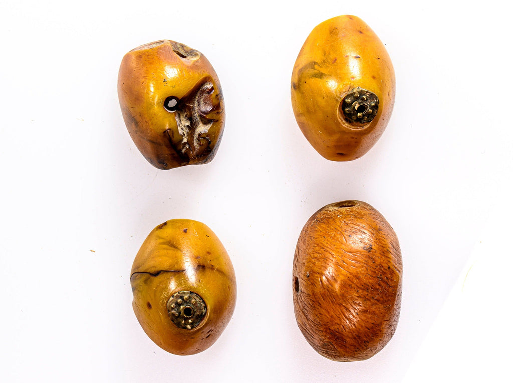 A group of 4  Vintage Rare-Shaped "African amber" phenolic resin beads with metal caps from Morocco CRJP070